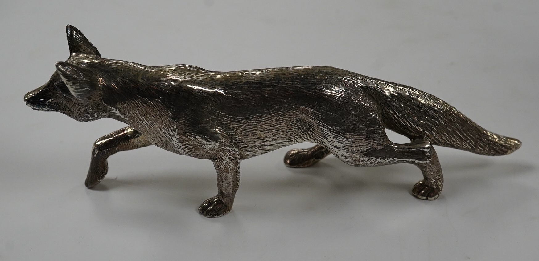 An Elizabeth II silver free standing model of a fox, C.J. Vander Ltd, Birmingham, 1965, length 15.8cm, 7oz. Condition - good